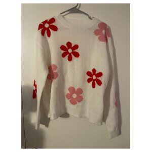 White sweater with red and pink flowers